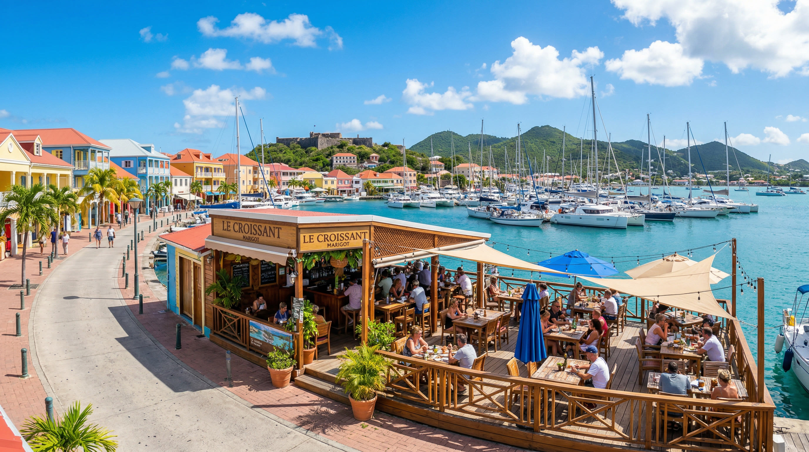 Sandy's Waterfront Bar on the Marigot marina with boats and colorful buildings